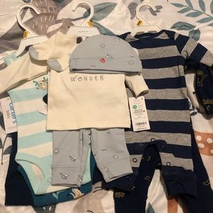 multiple sets of newborn clothes